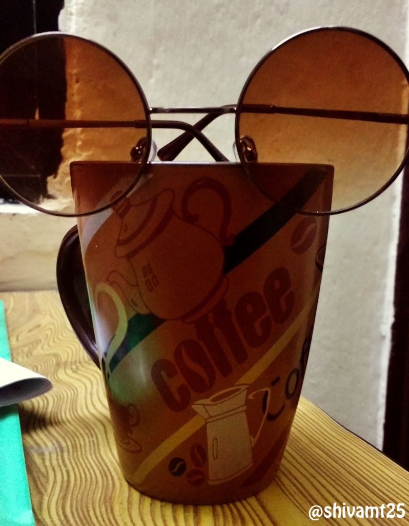 coffee cup and sunglasses